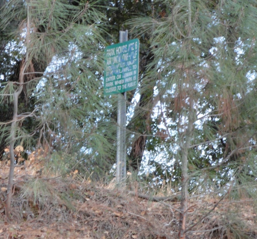 Park sign behind shopping center